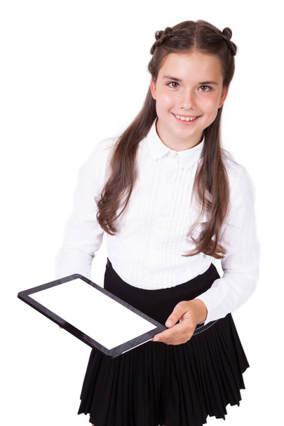 Schoolgirl in a shirt with electronic tablet - Foto, Imagen