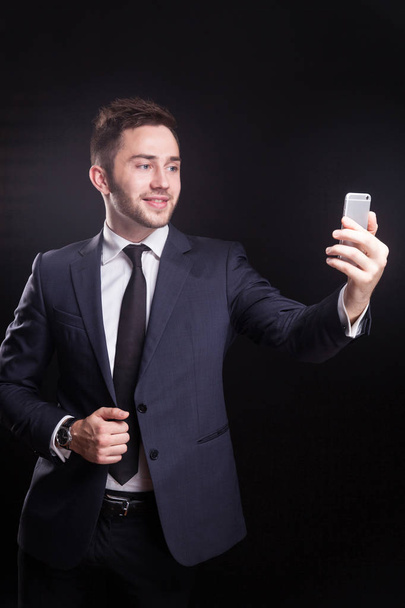 Young businessman taking selfie - Photo, Image