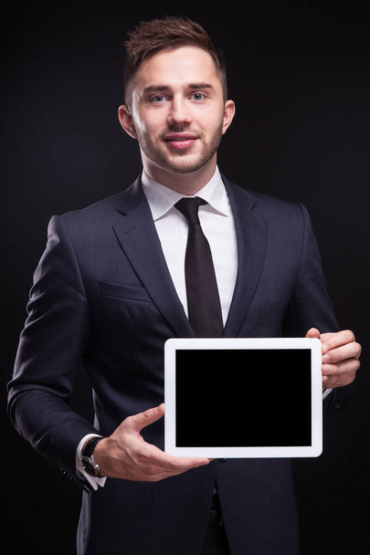 Young businessman with tablet in hands - Fotoğraf, Görsel