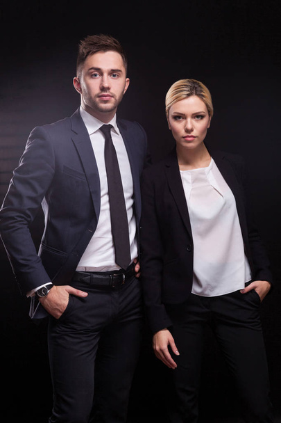 Young confident businessman and businesswoman - Фото, зображення