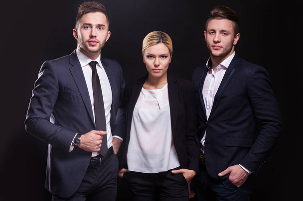 Team of three successful businesspeople - Фото, изображение