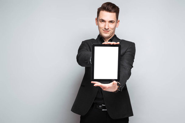 Young businessman holding tablet  - Photo, image