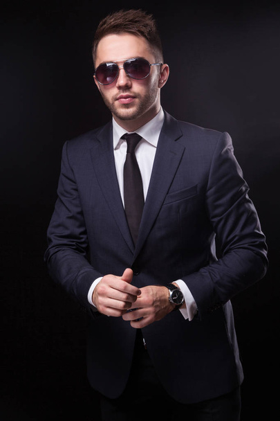 Young confident businessman in sunglasses - Фото, зображення