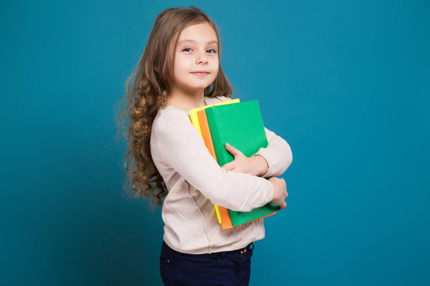 Cute brunette girl with paper folders - Φωτογραφία, εικόνα