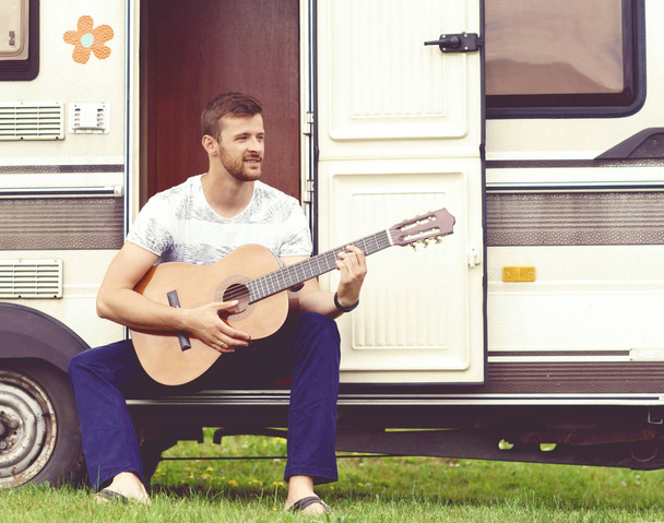 handsome bearded guy playing guitar - Zdjęcie, obraz