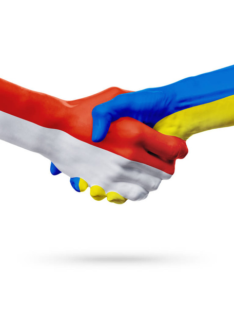 Flags Monaco, Ukraine countries, partnership friendship handshake concept. - Фото, зображення