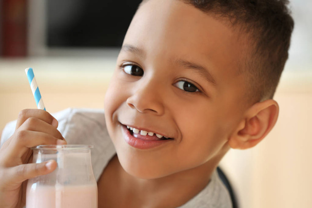 African boy drinking yogurt - Foto, Imagem