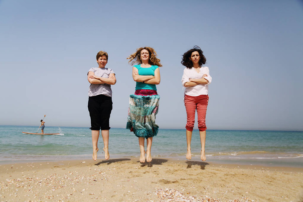 mature women having fun on seaside - Photo, image