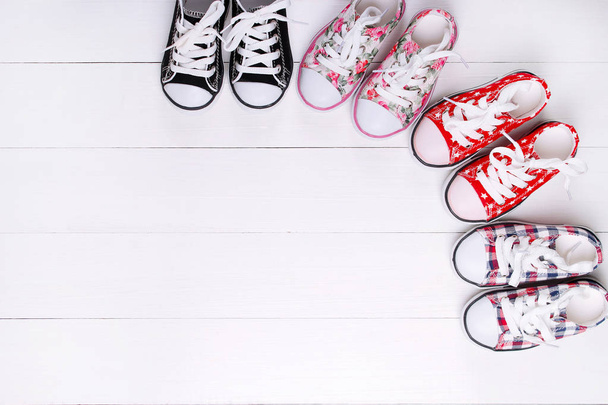 Fashion. Baby sneakers on a white background - Foto, Imagen