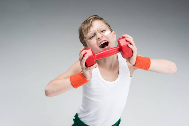 active boy with dumbbell - Foto, imagen