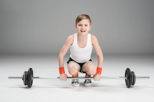 active boy training with barbell - Foto, immagini