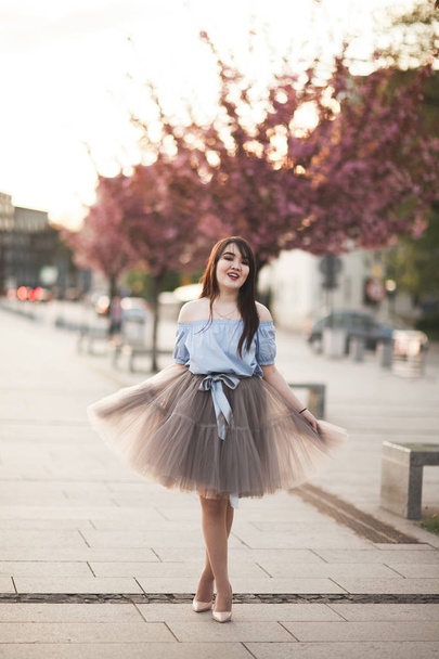 Young Asians girl with modern dress posing in an old Krakow - Foto, Imagen
