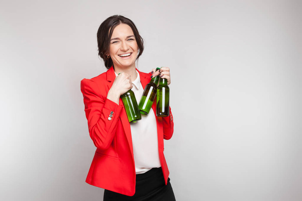 Attractive woman in red with green beer - Photo, Image