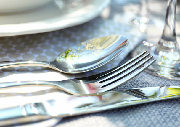 Cutlery on light tablecloth, closeup - Φωτογραφία, εικόνα