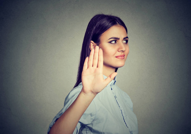 Upset angry woman giving talk to hand gesture with palm outward - Photo, image
