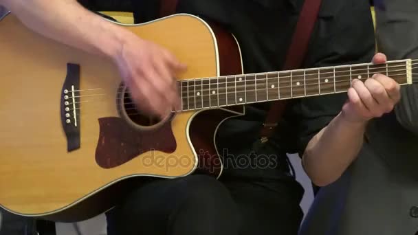 Playing on the acoustic guitar. - Footage, Video