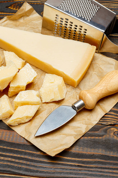 parmesan cheese on wooden background - 写真・画像