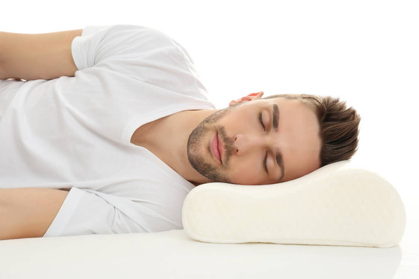 man sleeping on bed with orthopedic pillow - Foto, Imagem