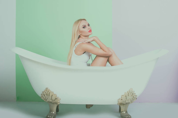 bath tub white color with sexy woman or young girl - Φωτογραφία, εικόνα