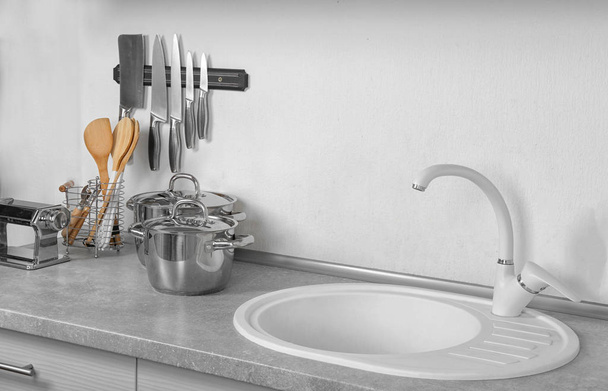 Sink and utensils in kitchen - Photo, Image