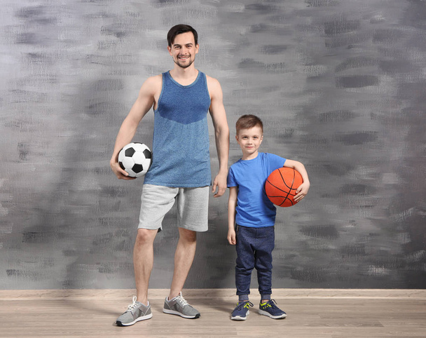 Father and son with balls  - Фото, зображення