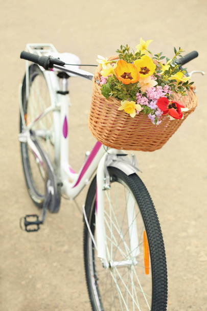Bicycle with beautiful basket of flowers  - Zdjęcie, obraz