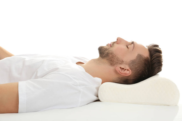 man sleeping on bed with orthopedic pillow - Φωτογραφία, εικόνα