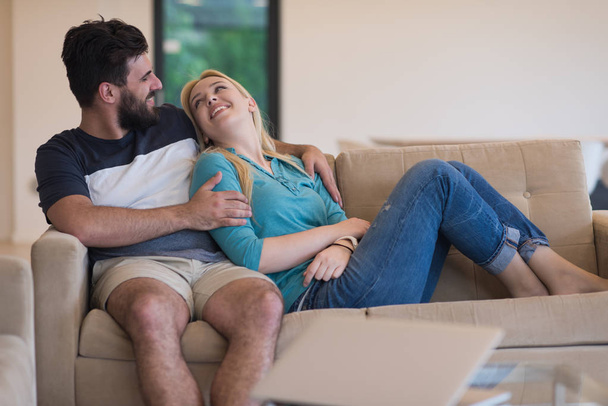 young happy couple relaxes in the living room - Foto, immagini