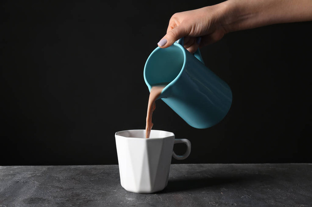 pouring cocoa into cup  - Fotó, kép