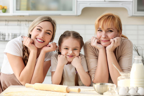 woman with mother and daughter cooking  - Photo, image