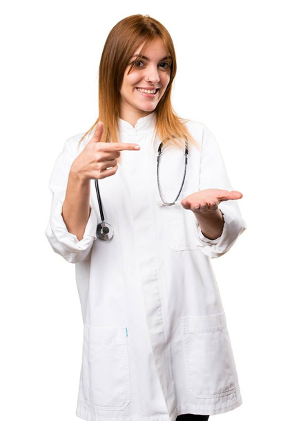 Young doctor woman holding something - Photo, Image