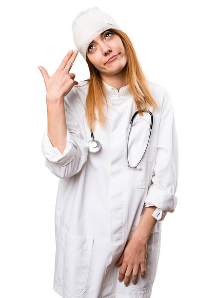 Young doctor woman with headache - Valokuva, kuva