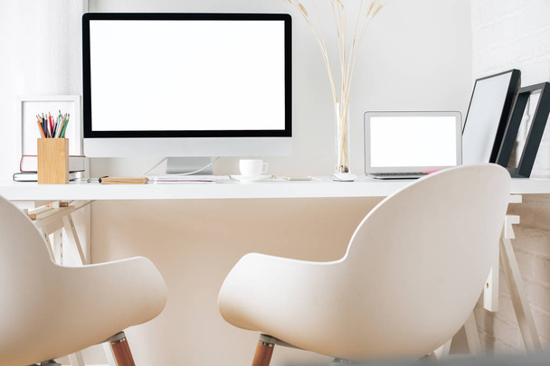 Modern workplace with white devices - Zdjęcie, obraz