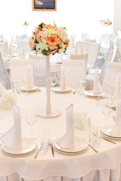 Glasses on the festive table setting. Wedding table decor. Table setting in classic style, setout, layout. - Photo, Image