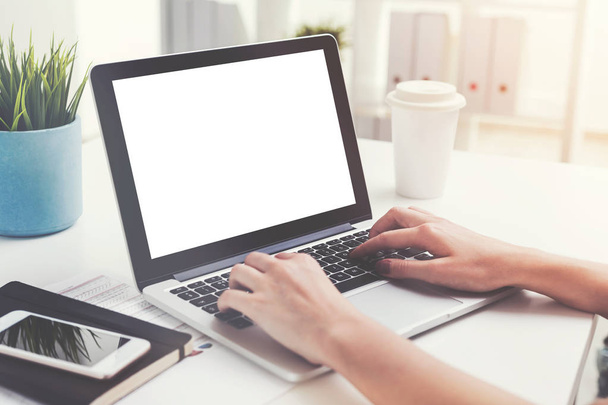 Woman s hands typing on laptop with blank screen - Photo, image