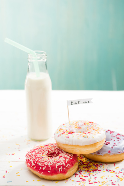 Donuts  with milkshake in bottle on the table - Photo, Image