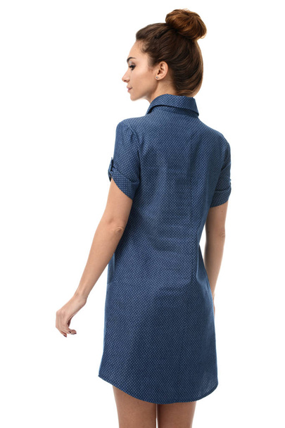 brunette woman standing backward posing in new fashion body dres - Valokuva, kuva