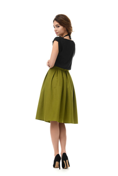 brunette woman standing backward posing in new fashion body dres - Foto, Imagen