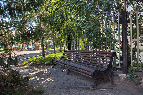Old wooden bench in the Petropavl (russian city name is Petropavlovsk).  - Fotoğraf, Görsel