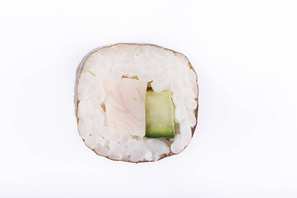 Traditional fresh Japanese sushi rolls on a white background. Roll with cucumber and chicken - Photo, Image