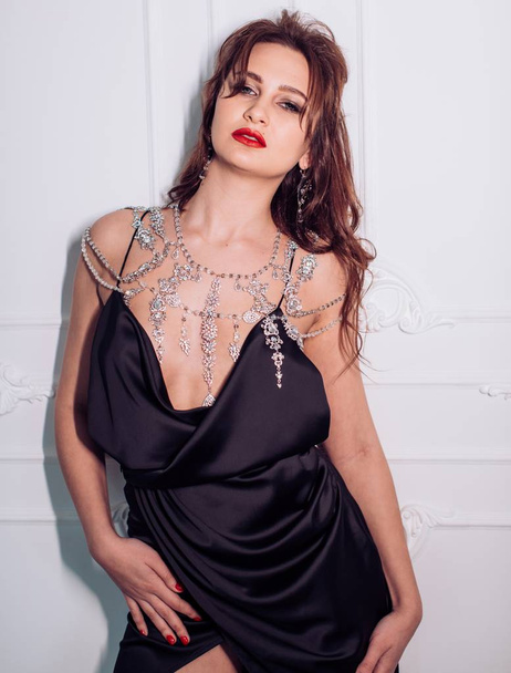young  woman in sexy black dress  - Fotografie, Obrázek