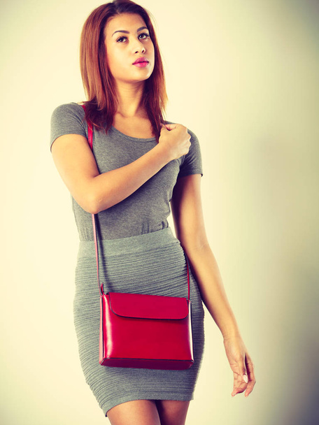 Mulatto girl gray wear with red handbag - Valokuva, kuva