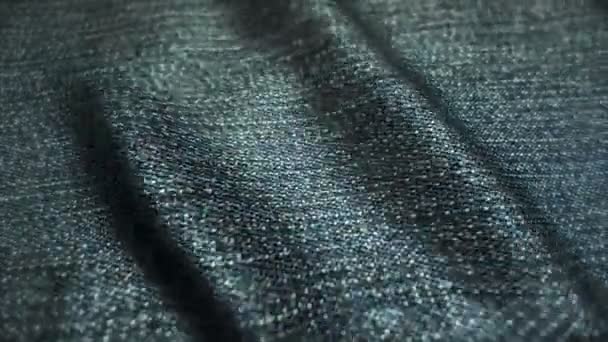 Realistic jeans waving in the wind. Abstract background Ultra-HD resolution. Close-up fabric texture. Seamless loop - Footage, Video