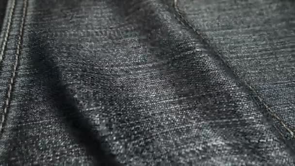 Realistic jeans waving in the wind. Abstract background Ultra-HD resolution. Close-up fabric texture. Seamless loop - Footage, Video