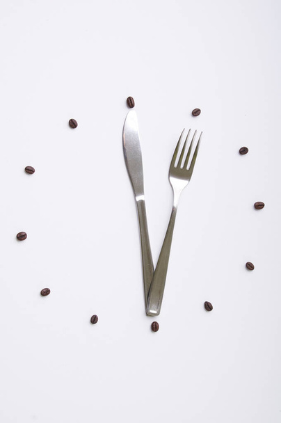 clock with fork and knife on white background - Φωτογραφία, εικόνα