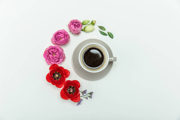 Beautiful flowers and cup of coffee - Zdjęcie, obraz
