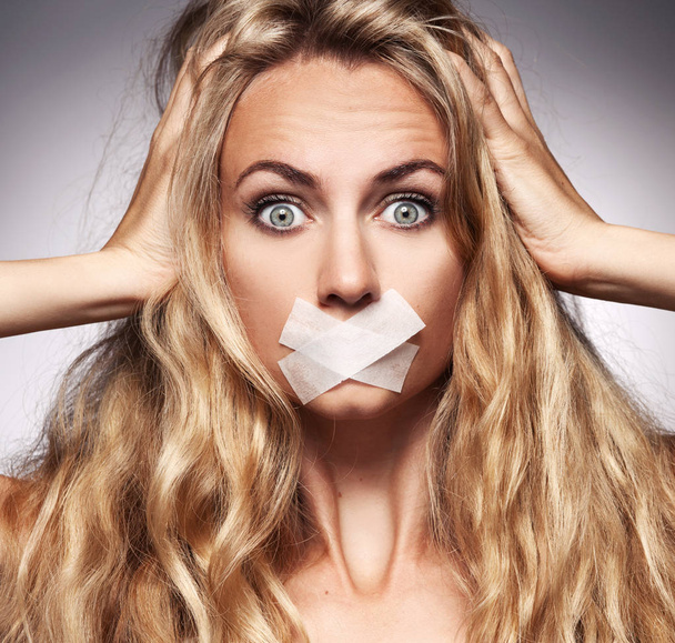 Woman with mouth sealed - Фото, зображення