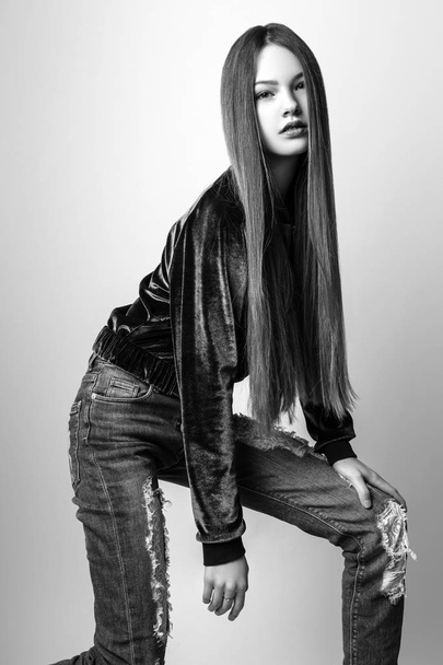 Cute girl teenage with long hair posing studio nature portrait. Black and white - Foto, afbeelding