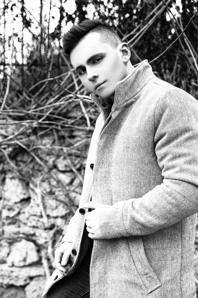 Fashion photo of young model man on street. Boy posing. Black and white - Fotoğraf, Görsel