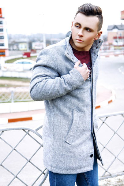 Fashion photo of young model man on street. Boy posing. - Foto, imagen